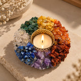 7 Chakra crystal tea light candle holder with a lit candle, natural chakra chips in rainbow segments – World of Oorja