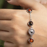 Wearing the Mulank 1 Sun charm bracelet on the wrist
