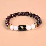 Capricorn zodiac bracelet with Capricorn glyph engraved onyx bead