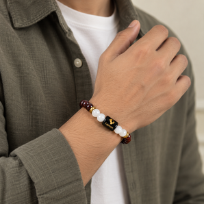 Capricorn zodiac bracelet in Garnet and Milky Quartz worn on the wrist