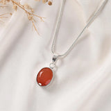 Carnelian pendant Classic bezel setting — faceted stone close view