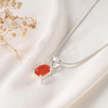 Carnelian pendant Prong setting angled view on silver snake chain