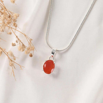 Carnelian pendant Prong setting front view with dried flowers