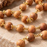 Close-up of Devadaru wood grain and gold-plated flower caps