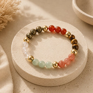 Dhan Vridhi bracelet with pyrite, carnelian, tiger eye, strawberry quartz and aventurine beads with gold spacers – World of Oorja