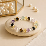 Exam Focus and Success bracelet with tiger eye, amethyst, citrine, clear quartz and fluorite beads on a beige stone – World of Oorja