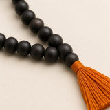 Close-up of 108+1 Karungali Jaap Mala beads