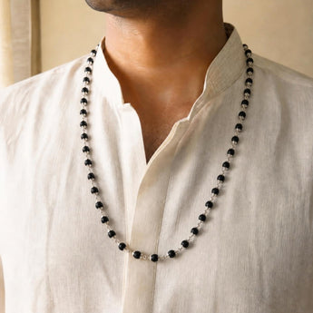 Silver Plated Karungali Mala worn by a man
