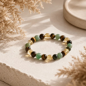 Money Attraction bracelet with citrine, green aventurine and tiger eye beads with gold accents on a stone plinth – World of Oorja