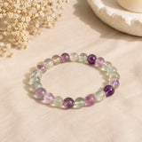 Multi-Fluorite bracelet with translucent mint green, lilac and clear banded beads on pale peach linen – World of Oorja