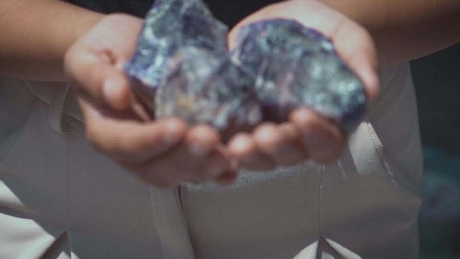 video of how raw crystals are cut polished and crafted into beaded bracelets