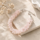 Rose Quartz chips bracelet with raw blush pink nuggets, silver spacers and lobster clasp on a cream stone tile – World of Oorja