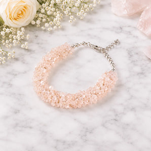 100% natural rose quartz chips bracelet on a subtle background 