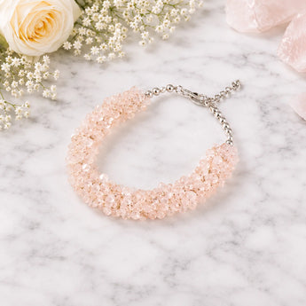100% natural rose quartz chips bracelet on a subtle background 