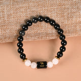 Scorpio Black Obsidian and Milky Quartz zodiac bracelet flat lay