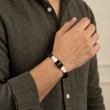 Scorpio zodiac bracelet in Black Obsidian and Milky Quartz worn on the wrist