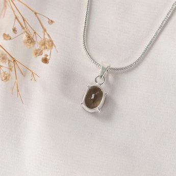 Close-up of the Smoky Quartz pendant in the Prong setting – natural brown-grey quartz and silver bail, World of Oorja
