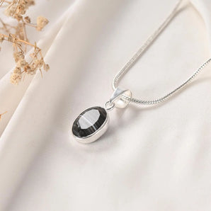 Sulemani Hakik pendant Classic bezel setting angled view on silver chain