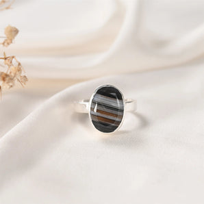 Sulemani Hakik ring in Classic bezel setting — natural banded black agate in German silver, front view