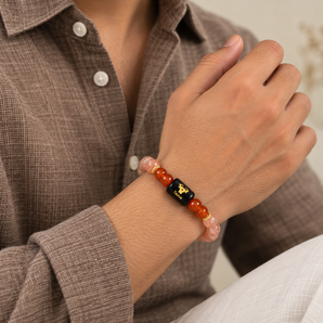 Taurus zodiac bracelet in Sunstone and Carnelian worn on the wrist